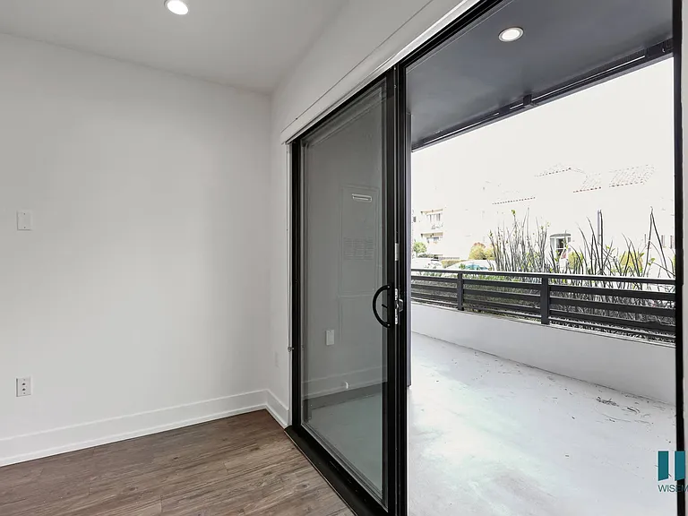 Bedroom with Sliding Glass Doors Leading to the Balcony