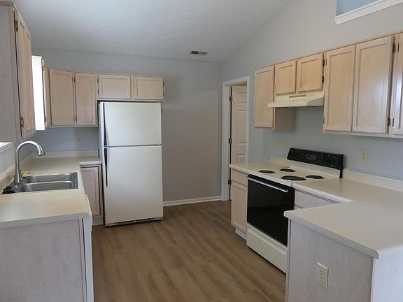 Larger size kitchen area, new flooring.
