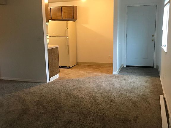 looking from slider to kitchen viewing the dining area and front door