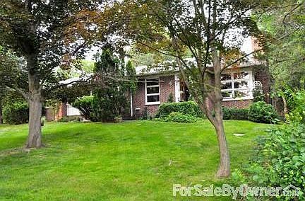 front yard : steps from private tennis and pool club, facing approx 25 acres of woods