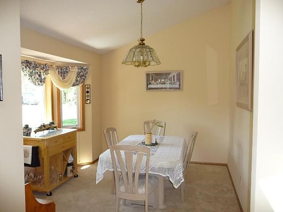 formal living room with bay window looks out in front