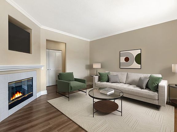 Renovated Package I living room with fireplace and updated hard surface flooring