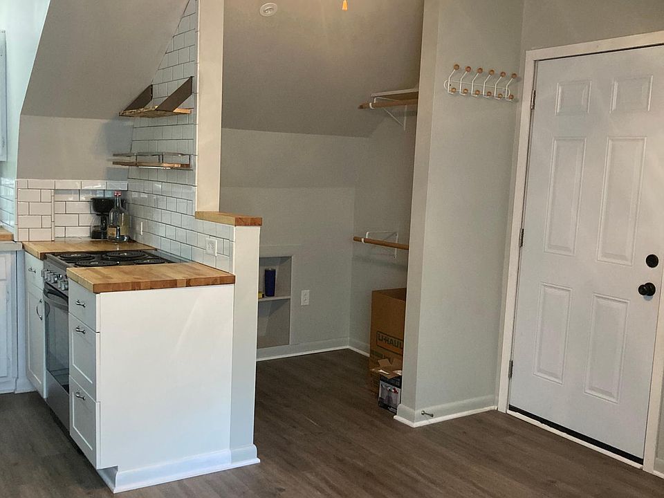 Walk-in Closet w/ 2 hanging racks. Closet has built in storage and room for chest of drawers