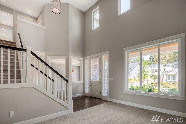 Hampton 4438 sf plan , elevation A ( Lot 8) is under construction, this photo is of another home and floorplan in a different community.  This photo is to be viewed as a sample of the different exterior colors, designs, details and finishes.