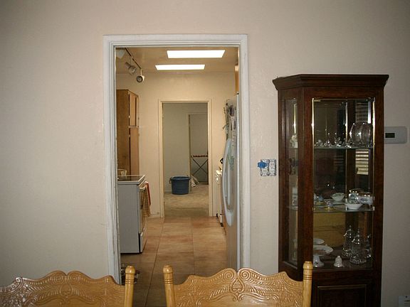 ENTRY WAY FROM DINING ROOM TO KITCHEN AND MASTER BEDROOM AND BONUS ROOM