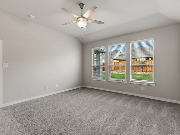 Primary bedroom in the Stanley home plan by Trophy Signature Homes