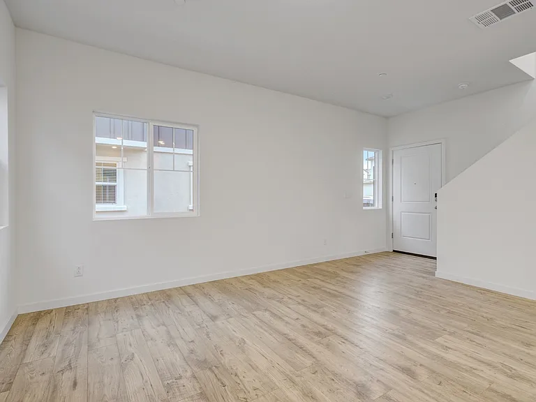 Entrance and living room with staircase