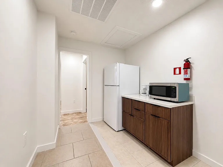 Upstairs kitchenette with microwave, toaster, coffee maker