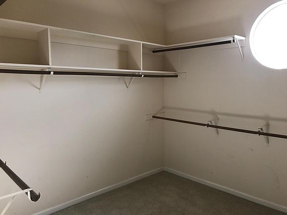 upstairs walk in closet master bedroom