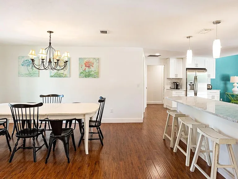 Foyer with view of dining room and kitchen counter