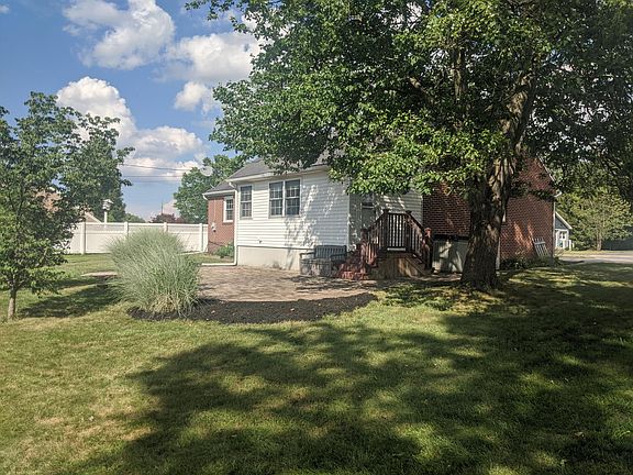 Large backyard and paver patio for relaxing and entertaining
