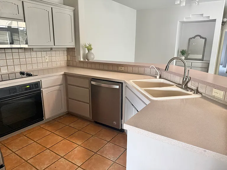 VIEW OF DINING AREA FROM KITCHEN.