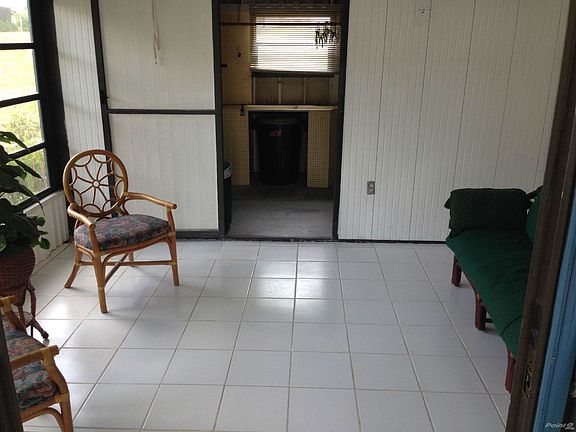 Florida Room with Entry to Laundry room/Shed