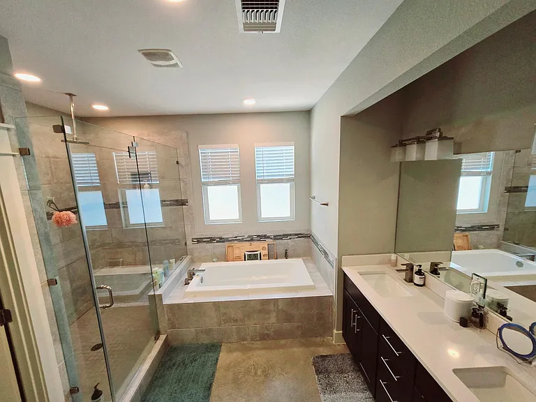 Private primary bathroom. Double sinks, Jacuzzi tub, large walk-in shower with dual faucets for 2 people, and a bidet!