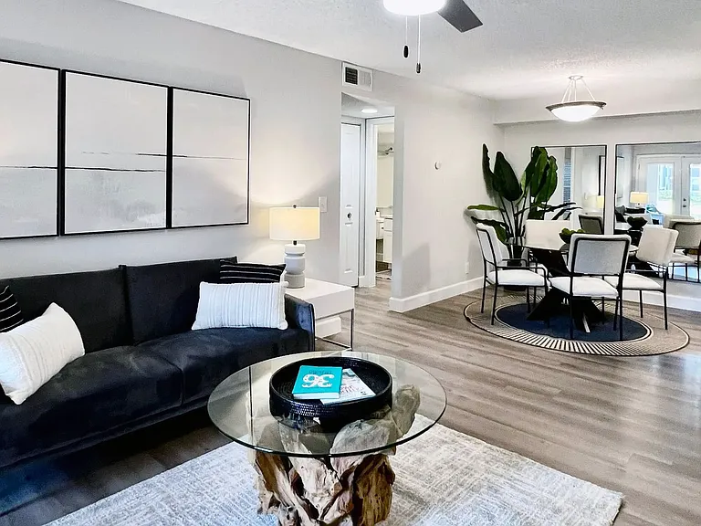 Take a seat in your open concept living room, perfect for chatting with guests while you cook.
