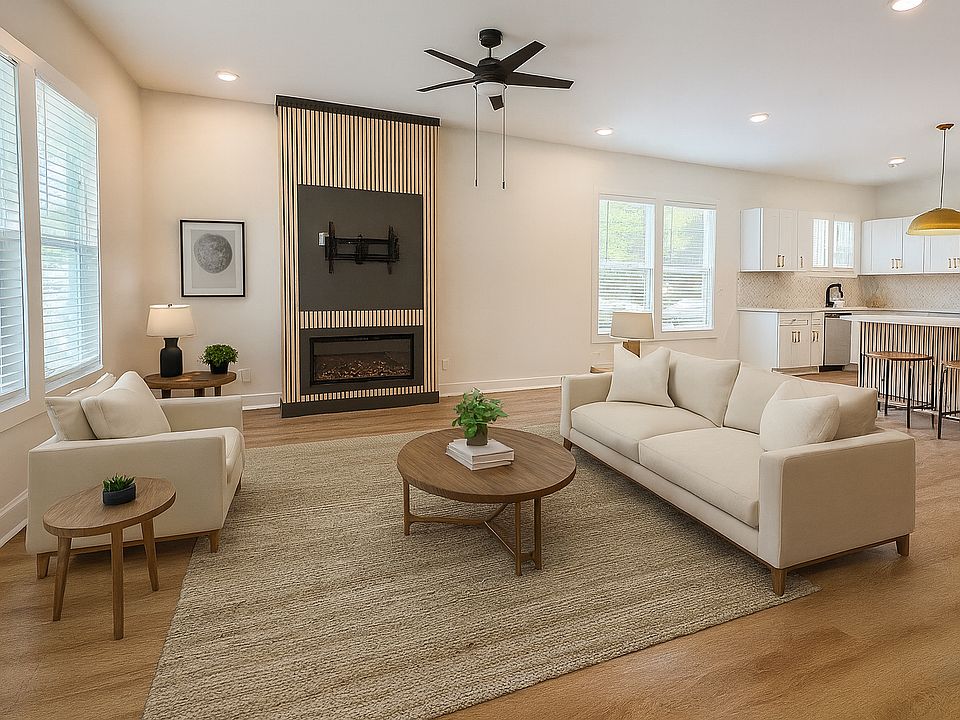 Relax in the den bathed in sunlight and enjoy the electric fireplace. The area for the TV comes with a TV mount pre-installed.