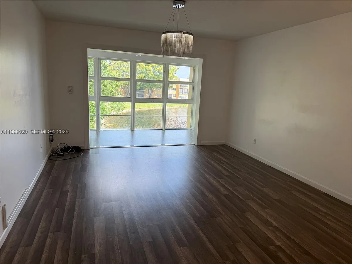 Photo 2 of 13 - 5851 NW 62nd Ave #305 - Tamarac, FL Building Photo - 5851 NW 62nd Ave #305