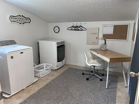 Huge laundry room with high end W/D & desk