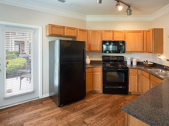 Gourmet kitchen with black appliances