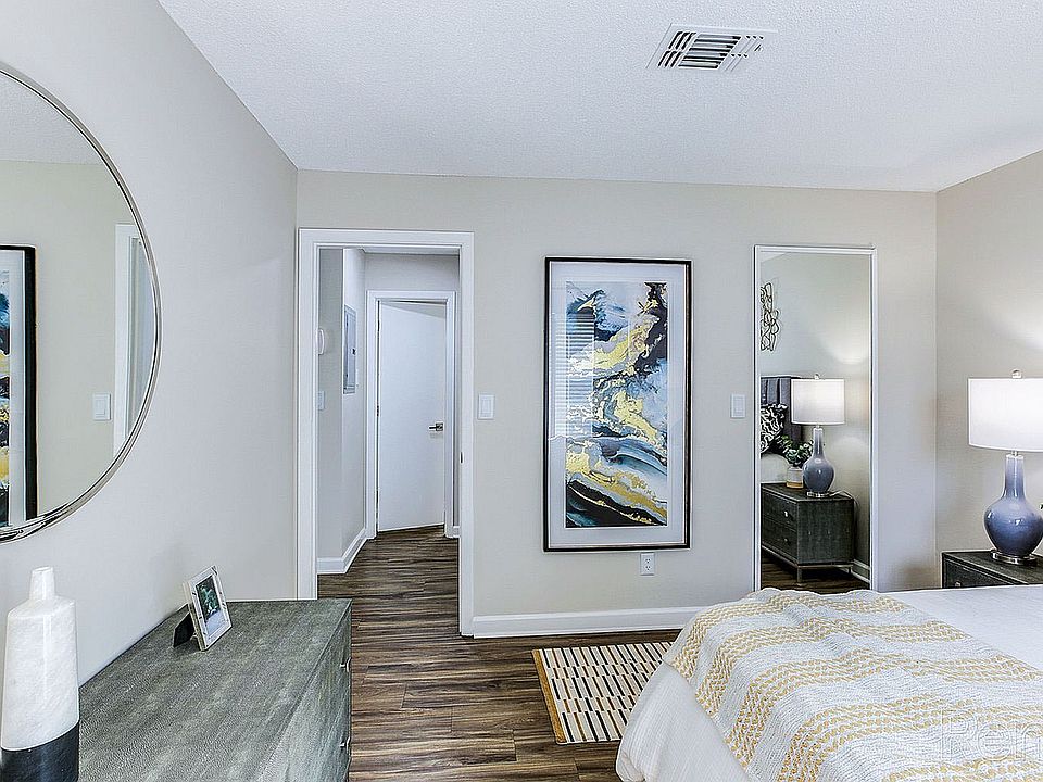 Bedroom with hardwood-style flooring