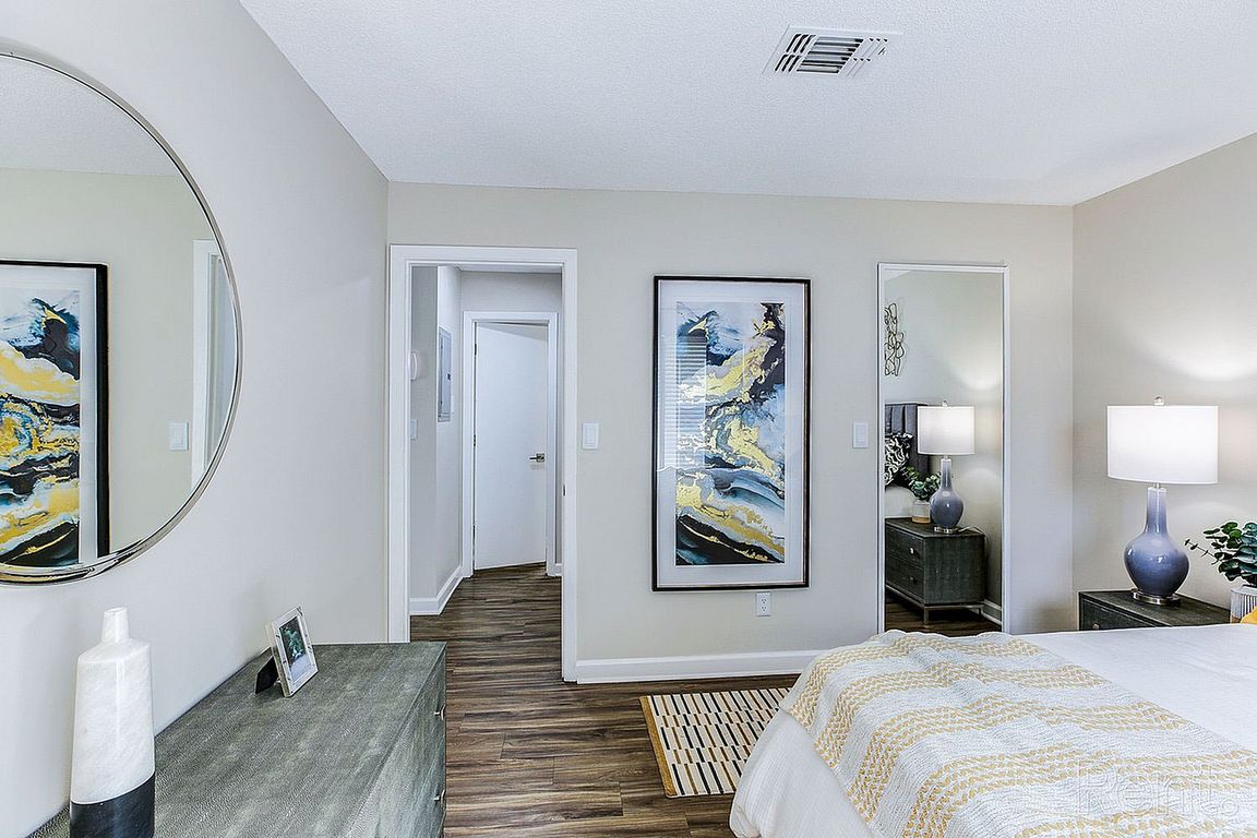 Bedroom with hardwood-style flooring