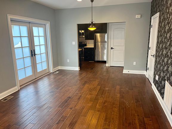 Living room looking into kitchen