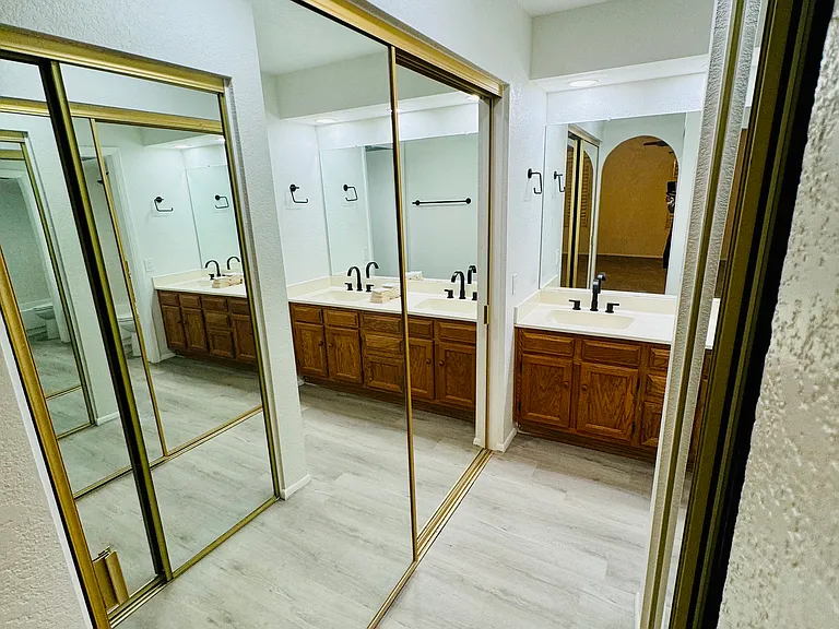 Mirrored hallway closets in upstairs master bedroom