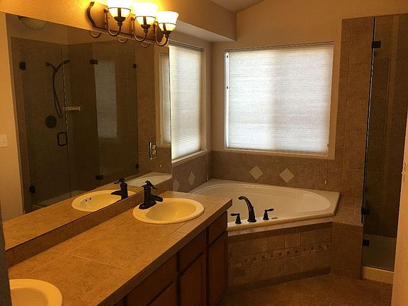 Large Mater bath with walk in shower and soaker tub.