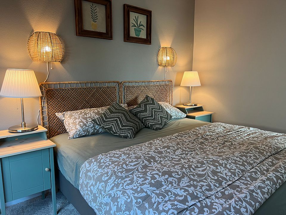 cozy kind bed with night stands