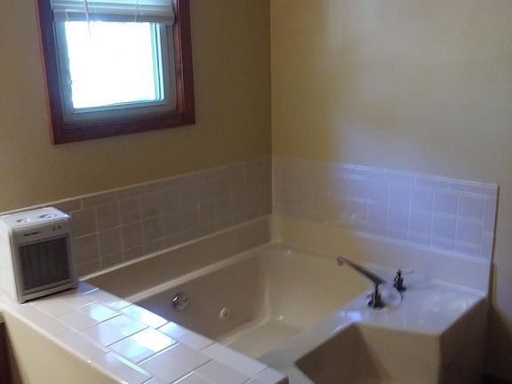 Hall bath ..garden tub and shower in the left corner