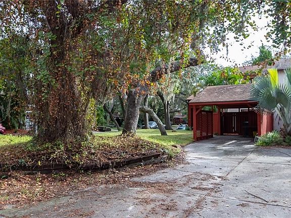 Large covered carport with shared private drive