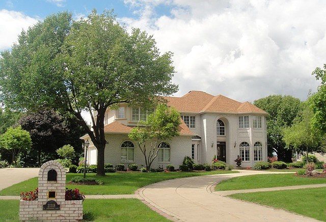 Gorgeous custom 3800 sq ft house on .85 acres with circular and side drive that leads to a 3 car gar