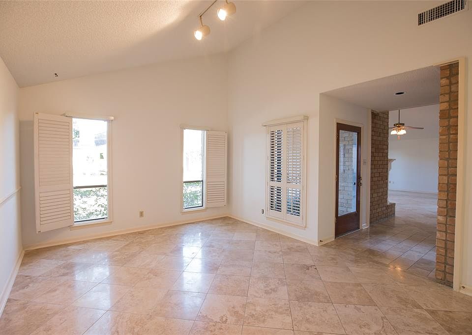 A view of the formal dinning room and the front door.