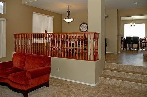 tri level home with wide stairs and upgraded wood railings