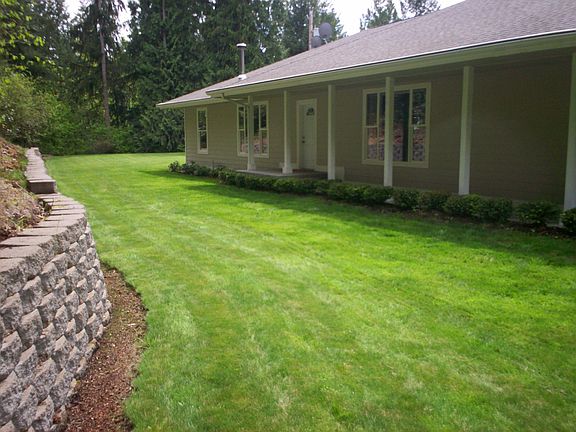 Private entry overlooks wooded forest 