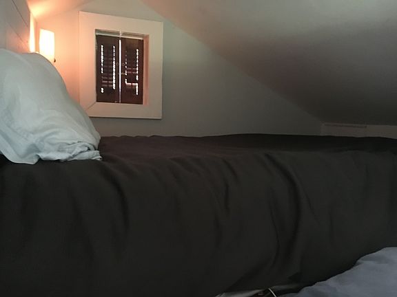 Lofted area for bed gives extra space