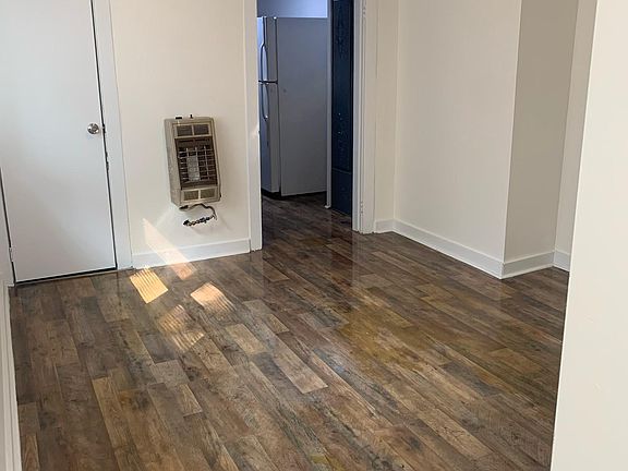 From the hallway, a den that can be used as a study, dining, or all purpose area. The bathroom is off of this room.