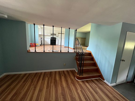 View from family room to kitchen and living room level.