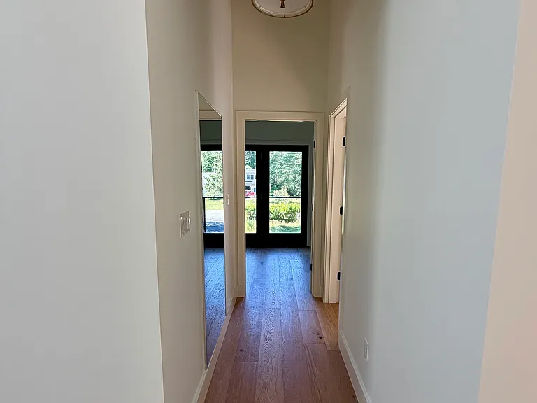 Hallway to primary bedroom