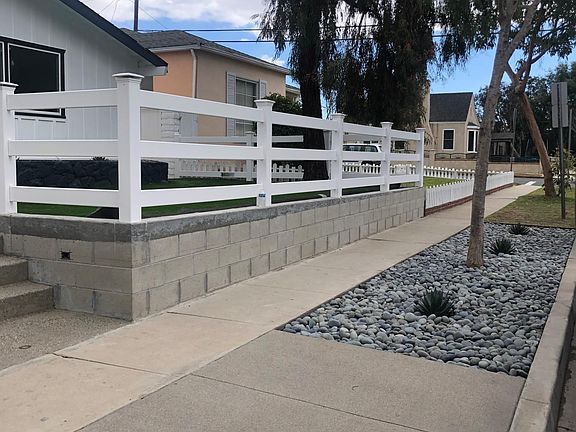 Sidewalk looking down the street with beautiful large pebbles
