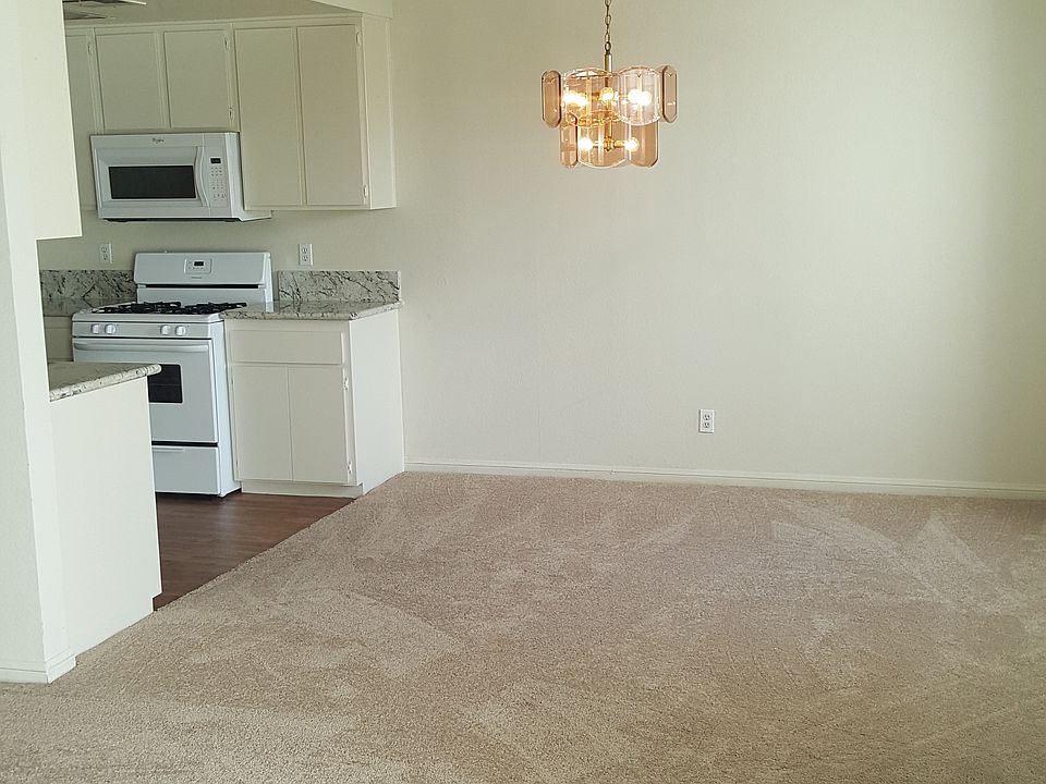 Open Dining Room Seats 8 to 12 / Connects to L-shaped Living