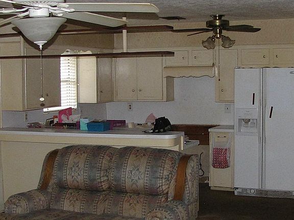 Kitchen opens to living room which makes visiting with your guests easy.