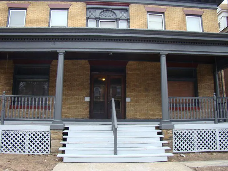 Exterior of 401 South Graham Street with large front porch