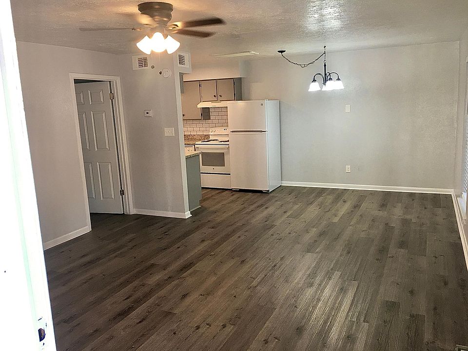 Large open floor plan of the living room, kitchen, and dining area.