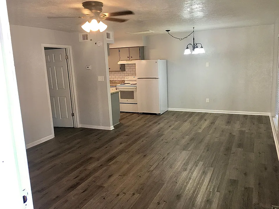 Large open floor plan of the living room, kitchen, and dining area.