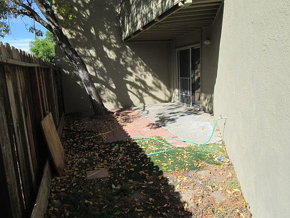 Private backyard with water spinet for gardening