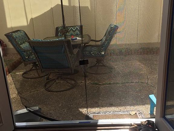 French doors leading to fully enclosed patio