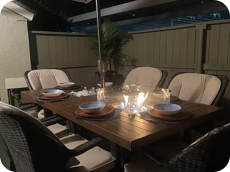 Front patio with outside fire pit table all included, fully furnished with new umbrella.