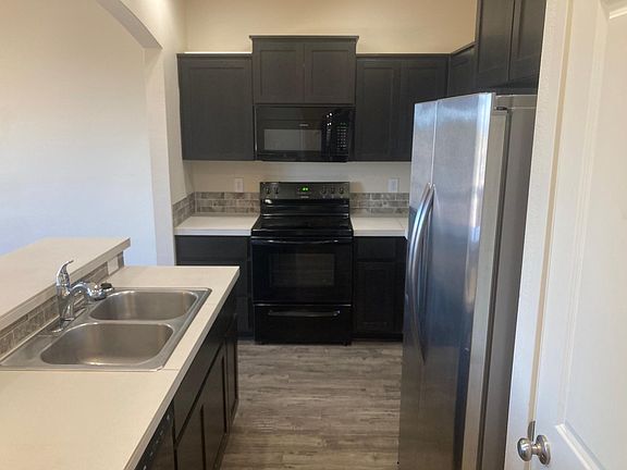 Kitchen with Refrigerator, Stove, Dishwasher, and large Pantry