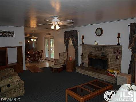 wood burning fireplace in living room
